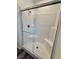 A walk in shower featuring subway tile and a glass door at 7041 Fossil Rim St, North Las Vegas, NV 89084