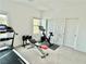 Well-lit workout room featuring exercise equipment and lots of space, perfect for a home gym at 7041 Fossil Rim St, North Las Vegas, NV 89084