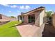 Backyard view featuring a covered patio area with an integrated sliding glass door at 7441 Aurora Glow St, Las Vegas, NV 89139