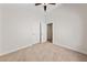 Bedroom featuring neutral carpet, light walls, a ceiling fan, and a closet at 7441 Aurora Glow St, Las Vegas, NV 89139