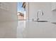 Close-up shot of countertop, showing smooth, reflective surface and faucet at 7441 Aurora Glow St, Las Vegas, NV 89139