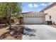 Charming single-story home featuring a well-maintained yard and a two-car garage at 7441 Aurora Glow St, Las Vegas, NV 89139