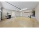Spacious garage with concrete floor, utility connections, door to outside, and storage shelving at 7441 Aurora Glow St, Las Vegas, NV 89139