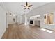 Bright living room with ceiling fan and fireplace at 7441 Aurora Glow St, Las Vegas, NV 89139