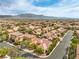 A picturesque aerial view captures a sprawling residential neighborhood with mountain backdrop at 7716 Twin Tails St, Las Vegas, NV 89149