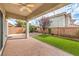 Backyard featuring a covered patio, small lawn, and privacy walls at 7716 Twin Tails St, Las Vegas, NV 89149