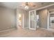 Bedroom with ceiling fan, ensuite bathroom and direct laundry access at 7716 Twin Tails St, Las Vegas, NV 89149
