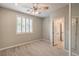 Bedroom with ceiling fan, shuttered window, and closet at 7716 Twin Tails St, Las Vegas, NV 89149