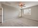 Large bedroom with shuttered windows, and access to an outdoor patio at 7716 Twin Tails St, Las Vegas, NV 89149