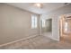 Carpeted bedroom with neutral walls and mirrored closet at 7716 Twin Tails St, Las Vegas, NV 89149