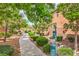 A tranquil community path lined with mature trees and landscaping offers residents a serene escape at 7716 Twin Tails St, Las Vegas, NV 89149