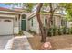 Close up of a charming home featuring a decorative front door, desert landscaping, and tiled entryway at 7716 Twin Tails St, Las Vegas, NV 89149