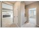 Hallway view of a kitchen and another room, showcasing the home's open layout at 7716 Twin Tails St, Las Vegas, NV 89149