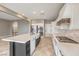 Bright kitchen featuring an island with a sink, a gas range, and stainless appliances at 7716 Twin Tails St, Las Vegas, NV 89149
