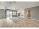 Spacious living room featuring recessed lighting, tile floors, a fireplace, and sliding glass doors at 7716 Twin Tails St, Las Vegas, NV 89149