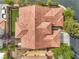 Aerial view of a red tile roof with landscaping, driveway, and surrounding neighborhood at 7716 Twin Tails St, Las Vegas, NV 89149