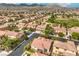 Neighborhood street view near a park, with beautiful homes and well-maintained landscaping at 7716 Twin Tails St, Las Vegas, NV 89149