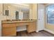 Bathroom featuring a double vanity with granite counters, tile floors and large mirror at 7808 Brook Valley Dr, Las Vegas, NV 89123