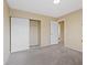 Neutral bedroom featuring a walk-in closet, neutral walls and gray carpet at 7808 Brook Valley Dr, Las Vegas, NV 89123