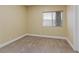 Bedroom with neutral carpet and a window with blinds at 7808 Brook Valley Dr, Las Vegas, NV 89123