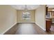 Dining room with wood floors and a view of the backyard pool at 7808 Brook Valley Dr, Las Vegas, NV 89123