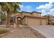 Charming two-story home featuring a three car garage and desert landscaping at 7808 Brook Valley Dr, Las Vegas, NV 89123