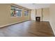 Cozy living area with fireplace, wood floors and large windows at 7808 Brook Valley Dr, Las Vegas, NV 89123