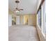 Spacious main bedroom with lots of natural light from large windows, ceiling fan and tan carpet at 7808 Brook Valley Dr, Las Vegas, NV 89123