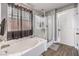 The primary bathroom offers a soaking tub and a stand-up shower at 7898 Red Rock Ridge Ave, Las Vegas, NV 89179