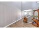This is an interior view of the entryway including stairs, wood floors, and a decorated side table at 7898 Red Rock Ridge Ave, Las Vegas, NV 89179