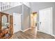 Bright entryway with stairs, wood floors, a coat closet, and access to the bathroom at 7898 Red Rock Ridge Ave, Las Vegas, NV 89179