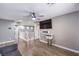 Upstairs loft area with grey walls, wood floors, a ceiling fan and bright lighting at 7898 Red Rock Ridge Ave, Las Vegas, NV 89179
