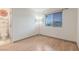 Light-filled bedroom with wood floors, bright walls, and a view to an adjacent bathroom at 805 Blue Springs Dr, Henderson, NV 89002