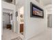 Hallway with neutral carpet and walls leading to a bathroom and bedroom at 805 Blue Springs Dr, Henderson, NV 89002