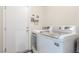 Laundry room with white washer and dryer, ample space, and convenient access at 805 Blue Springs Dr, Henderson, NV 89002