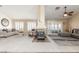 Large and bright living room with fireplace, neutral decor, and plantation shutters at 805 Blue Springs Dr, Henderson, NV 89002