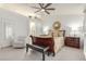 Spacious and bright main bedroom with ceiling fan, neutral paint, and sleek furniture at 805 Blue Springs Dr, Henderson, NV 89002