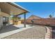 Backyard with covered patio, outdoor grill area, and low-maintenance landscaping at 8141 Guava Nectar Ave, Las Vegas, NV 89131