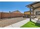 Backyard with lawn, covered patio, brick wall, and low-maintenance landscaping at 8141 Guava Nectar Ave, Las Vegas, NV 89131