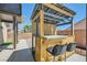 Backyard built-in grilling station with barstool seating at 8141 Guava Nectar Ave, Las Vegas, NV 89131