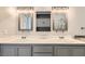 Bathroom featuring double sinks, well-lit mirrors, and lots of storage space at 8141 Guava Nectar Ave, Las Vegas, NV 89131
