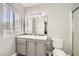 Well-lit bathroom featuring a single sink, modern vanity, and a glass door shower at 8141 Guava Nectar Ave, Las Vegas, NV 89131