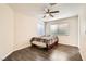 Comfortable bedroom with wood floors, ceiling fan, and a cozy bed at 8141 Guava Nectar Ave, Las Vegas, NV 89131