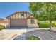 Charming single-story home featuring a two-car garage, desert landscaping, and a neatly maintained front yard at 8141 Guava Nectar Ave, Las Vegas, NV 89131