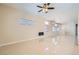 Bright and open living room featuring tile flooring, recessed lighting, and a modern fireplace at 8141 Guava Nectar Ave, Las Vegas, NV 89131