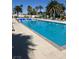 Beautiful outdoor pool surrounded by lounge chairs and palm trees, perfect for relaxation at 8255 Las Vegas Blvd # 405, Las Vegas, NV 89123