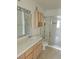 Clean bathroom with tile flooring, vanity, and a glass-enclosed shower at 8452 Boseck Dr # 216, Las Vegas, NV 89145
