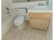Bathroom featuring white tiled walls, a bathtub, and a single sink vanity with wooden cabinets at 8452 Boseck Dr # 216, Las Vegas, NV 89145