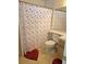 Bathroom displaying a red heart theme, shower, toilet, sink, and cabinet at 8452 Boseck Dr # 216, Las Vegas, NV 89145