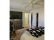 Bedroom with carpeted floors and ceiling fan, featuring a dresser and walk-in closet at 8452 Boseck Dr # 216, Las Vegas, NV 89145